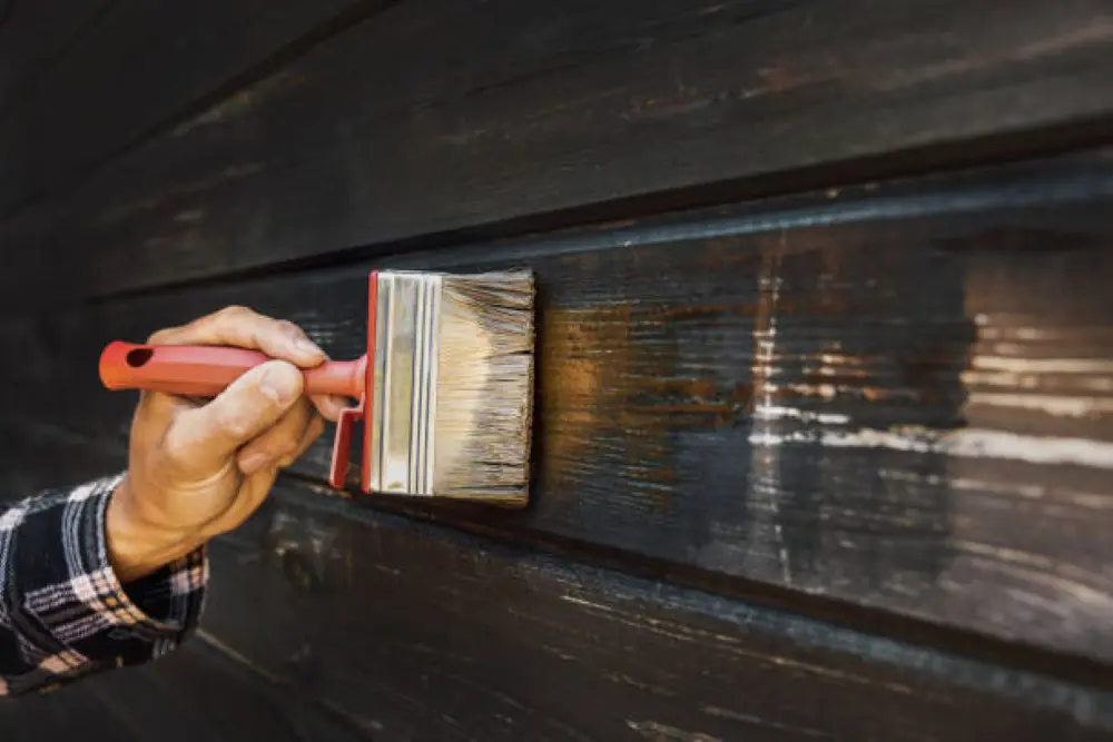 applying a second coat to siding