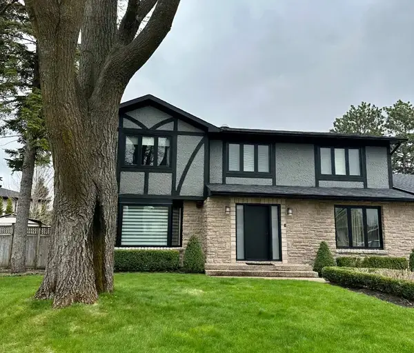 Ottawa-Windows Ottawa Tudor-style home with black-trim windows and door
